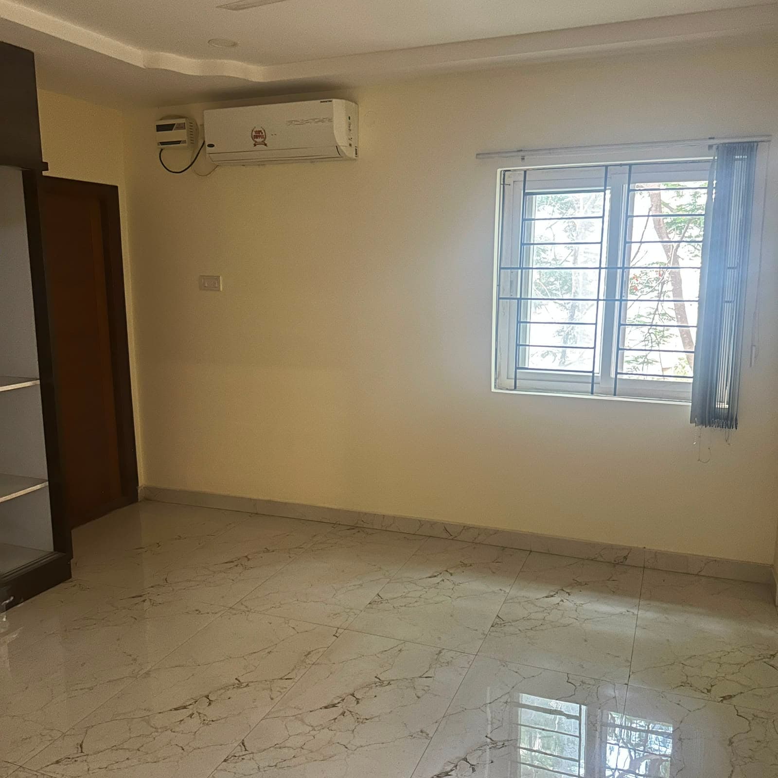 Consultation room at Hitex Health Nest, with a window looking onto trees