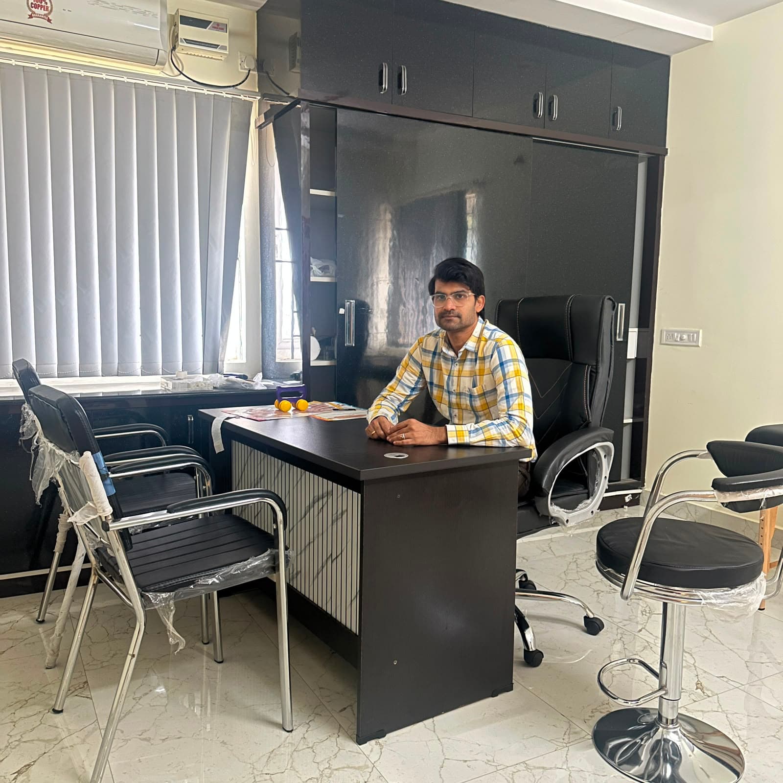 Dr. Bhaskar Reddy at the consultation desk